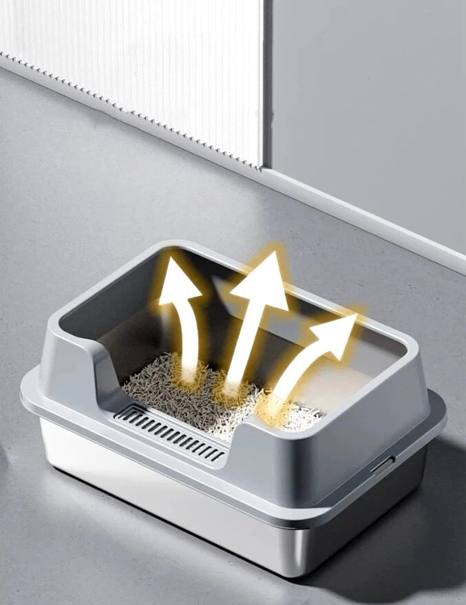 Gray plastic cat litter box with litter and arrows indicating odor ventilation in a clean indoor space