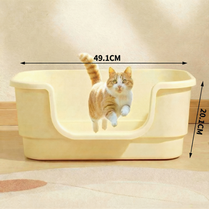 Orange tabby cat jumping out of cream-colored plastic cat litter box with measurements 49.1cm by 20.1cm