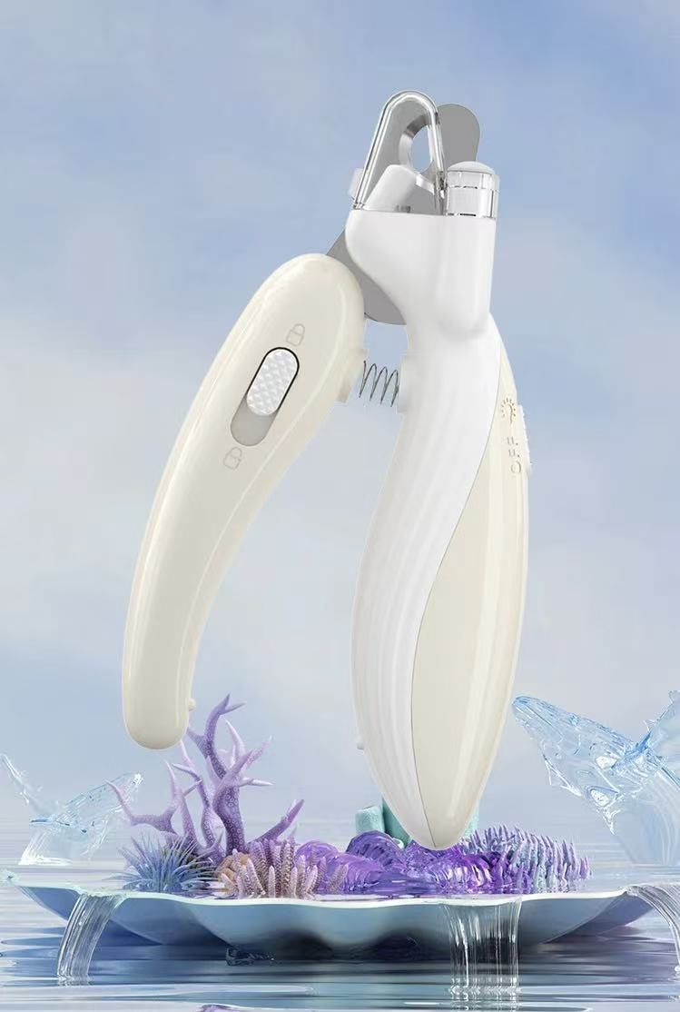 White handheld nail clipper with ergonomic handle displayed on a decorative plate with purple coral and sea elements
